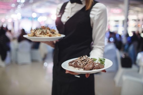 waitress with food plate in hand
