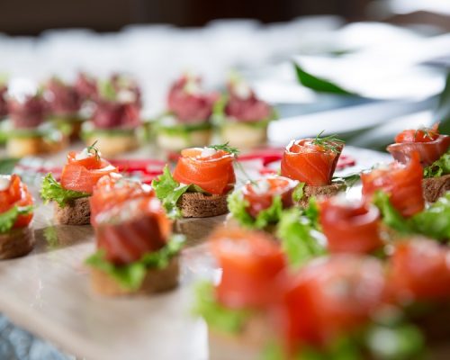 Mini Canapes with Smoked Salmon on Buffet Table